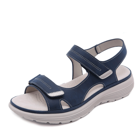 Blue sandal with white sole on a white background, featuring a 'Free Insoles' badge.